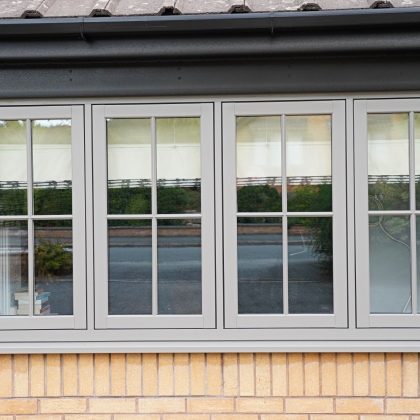 House with PVCu Flush sash bay windows
